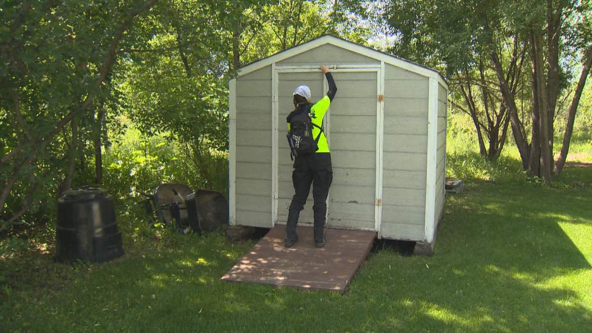 Winnipeg Search and Rescue (WINSAR) search sheds and backyards for Thelma Krull Monday.