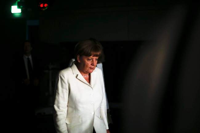 German Chancellor Angela Merkel arrives for an interview at the TV studios of German public broadcaster ARD in Berlin, Germany, Sunday, July 19, 2015.