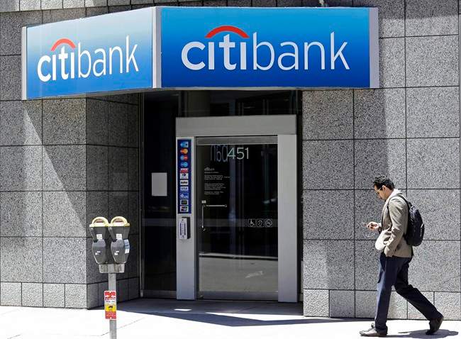 A man walks past a branch of Citibank in the Financial District in San Francisco.