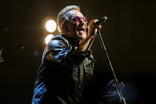 FILE - In this May 26, 2015 file photo, Bono of U2 performs at the Innocence   Experience Tour at The Forum in Inglewood, Calif. 