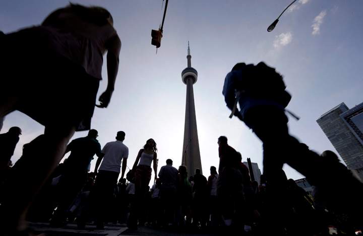 People make their way towards the CN Tower and Rogers Centre to see the opening ceremony of the Toronto 2015 Pan Am Games on July 10, 2015. The Games gave Toronto new sports facilities and tested existing ones for an Olympic Games bid, if the city has the appetite for it. 