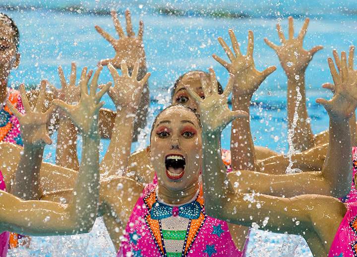 Mexico’s synchronized swimming team performs a clown inspired number for the free routine at the Pan Am Games in Toronto on Saturday, July 11, 2015.