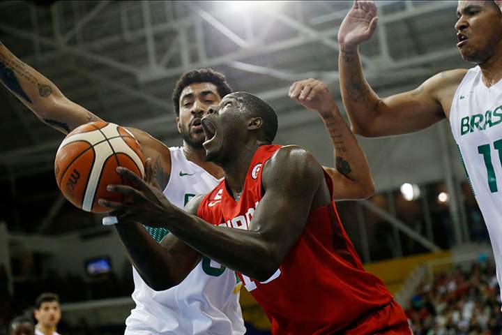 Canada’s Anthony Bennett looks to shoot against Brazil’s Augusto Lima, left, and Rafael Hettsheimeir during the first quarter of the men’s basketball gold medal game at the Pan Am Games on Saturday, July 25, 2015.