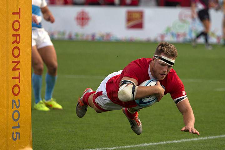 Canada’s Conor Trainor dives past the post to score a try during Canada’s 22-19 win over Argentina to win gold in the men’s rugby sevens at the Pan Am Games in Toronto on Sunday, July 12, 2015.