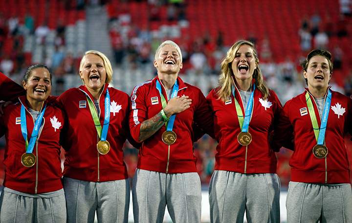 Canada celebrates on the podium after they won the gold medal in the women’s Rugby 7 competition on Day 2 of the Toronto 2015 Pan Am Games on July 12, 2015 in Toronto.