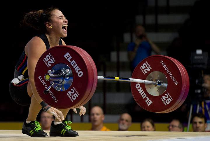 Venezuela’s Yusleidy Figueroa Roldan shouts after struggling on a lift attempt in the women’s 58kg weightlifting at the Pan Am Games in Oshawa, Ontario on Sunday, July 12, 2015.