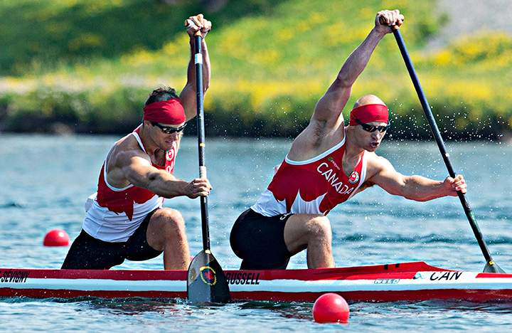 Canada’s Gabriel Beauchesne-Sevigny, left, and Benjamin Russell paddle their way to a gold medal victory in the men’s C2 1000m canoe race at the 2015 Pan Am Games in Welland, Ont., on Monday, July 13, 2015.