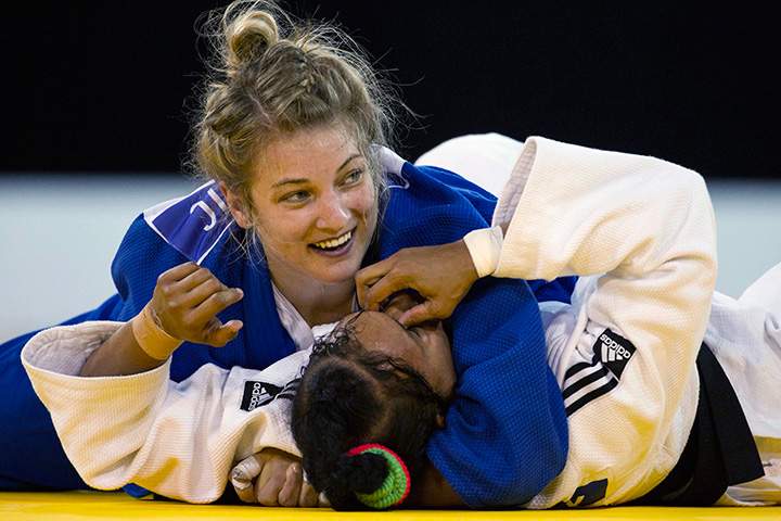 Canada’s Kelita Zupancic (left) reacts as she holds Cuba’s Onix Cortes in a hold to win gold in the women’s -70kg judo contest at the Pan Am Games in Mississauga, Ont. on Monday, July 13, 2015.