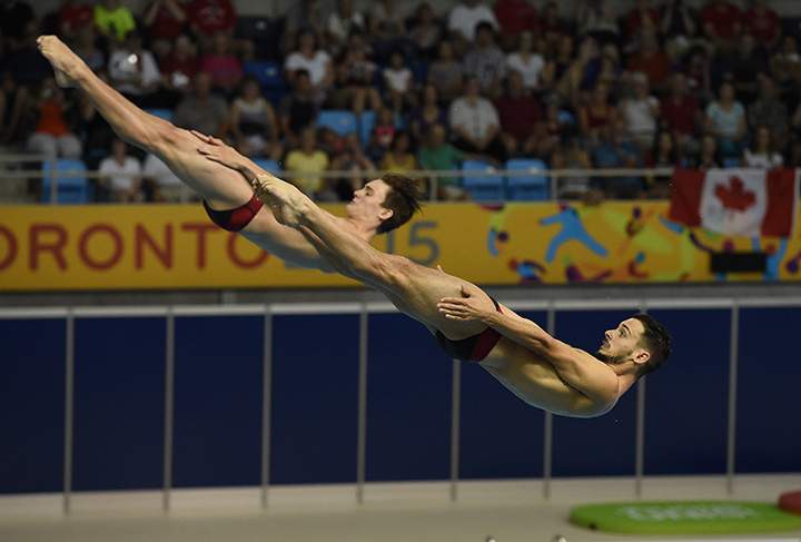Silver medalist Philippe Gagne and Francois Imbeau-Dulac of Canada compete during the Men’s Synchronized 3m Springboard Finals at the during the Toronto 2015 Pan American Games on July 13, 2015.