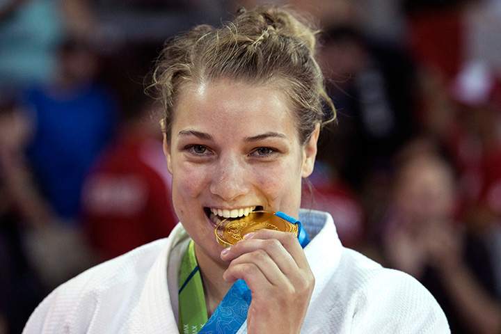 Canada’s Kelita Zupancic poses for photographers with her gold medal after beating Cuba’s Onix Cortes in the women’s -70kg judo contest at the Pan Am Games in Mississauga, Ont., on Monday, July 13, 2015.