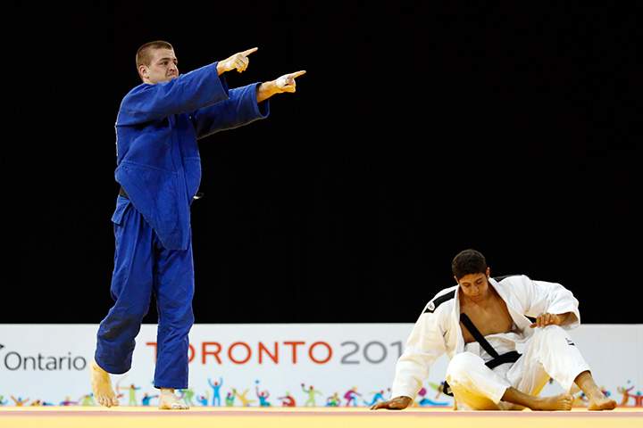 Canada’s Burt Zachary, left, celebrates after beating Mexico’s Yusef Farah during a men’s -81kg judo match at the Pan Am Games in Mississauga, Ontario on Monday, July 13, 2015.
