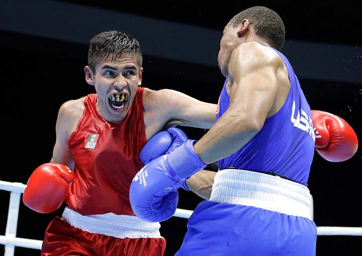 Marvin Cabrera, left, of Mexico, fights Brian Ceballo, of the United States, in a men’s preliminary welterweight bout at the Pan Am Games boxing competition in Oshawa, Ontario, Sunday, July 19, 2015.
