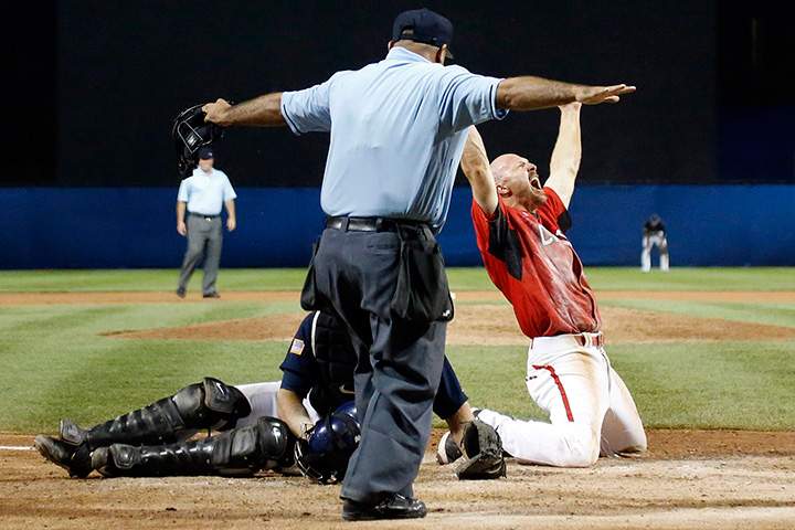 Canada’s Peter Orr, right, reacts after scoring the game-winning run under the tag of United States catcher Thomas Murphy’s in the 10th inning of the gold medal baseball game at the Pan Am Games in Ajax, Ontario, Sunday, July 19, 2015.