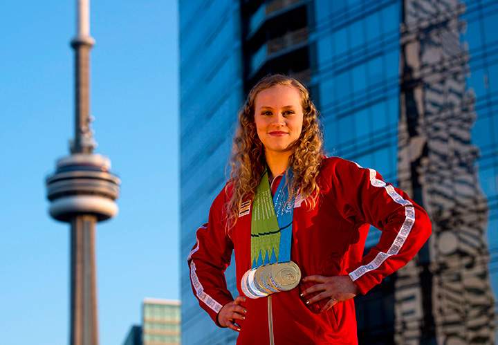 Canada’s Ellie Black poses for a photograph with her five medals she won at the women’s artistic gymnastics competitions during the Pan American Games in Toronto on Wednesday, July 15, 2015.