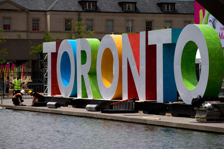 Workers erect giant letters spelling out Toronto in Nathan Phillips Square as they prepare for the Pan Am Games, Wednesday, July 8, 2015. The 2015 Pan Am Games officially open in Toronto on July 10.