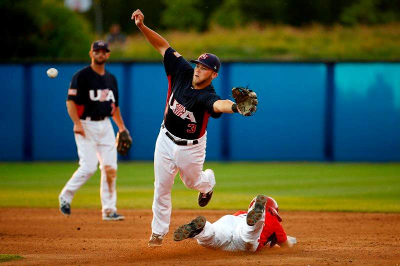 United States second baseman Jacob Wilson, center, is unable to catch an errant throw from catcher Thomas Murphy as Canada’s Peter Orr, right, steals second base during the fifth inning of the gold medal baseball game at the Pan Am Games, Sunday, July 19, 2015, in Ajax, Ontario.