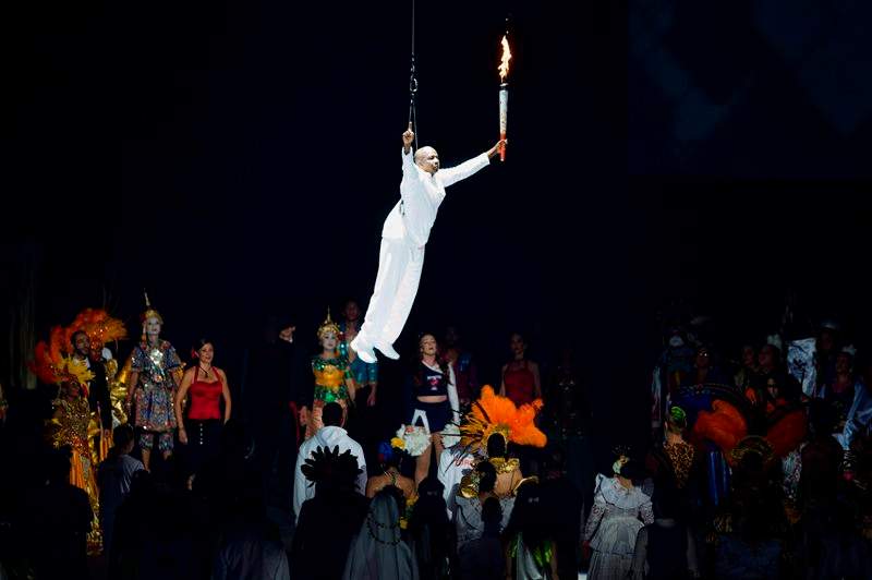 Former Olympian and world record sprinter Donovan Bailey is lowered into the Rogers Centre with the Pan Am flame during the 2015 Toronto Pan Am Games opening ceremony at the Rogers Centre on Friday, July 10, 2015. 