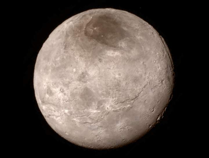 The photo reveals new details about Pluto's largest moon Charon in this photo taken from 466,000 kilometres away.