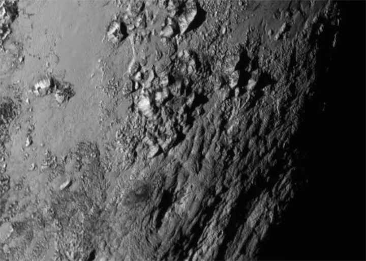 This close-up photo of Pluto gave Nasa researchers a surprise: a range of mountains as high as 11,000 feet (3,500 metres)