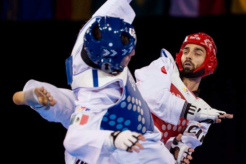 Canada's Maxime Potvin (right) competes against Mexico's Saul Gutierrez during his silver medal performance in the men's -68kg final taekwondo match at the Pan Am games in Mississauga, Ont., on Monday, July 20, 2015. 