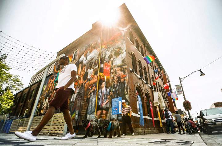 A man walks by PrideHouse Toronto following their opening ceremony ahead of the Pan American Games in Toronto Wednesday, July 8, 2015.
