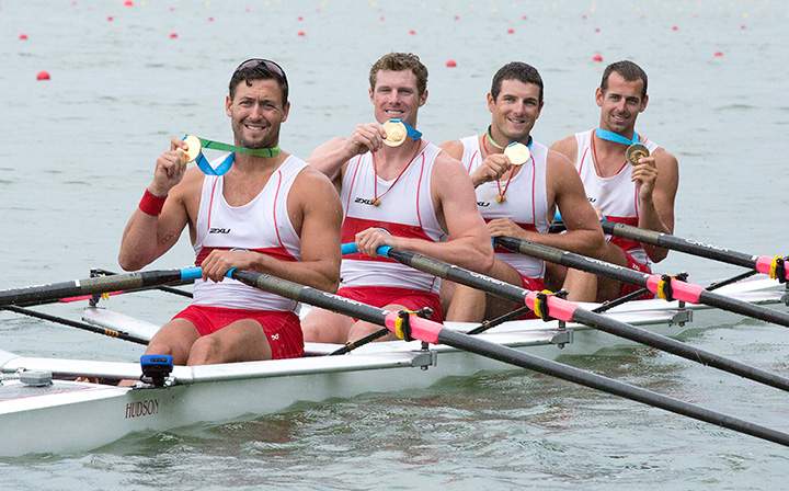 Canada’s left to right, Rob Gibson, Dean Will, Julien Bahain, and Matthew Buie hold up their medals after winning gold in the men’s quadruple sculls at the 2015 Pan Am Games at the Royal Canadian Henley Rowing Course in St. Catharines, Ont. on Tuesday, July 14, 2015.