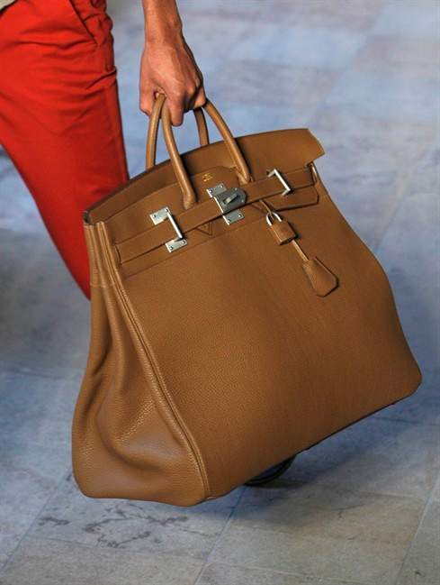 This June 25, 2011 file photo shows a model carrying a Birkin handbag.