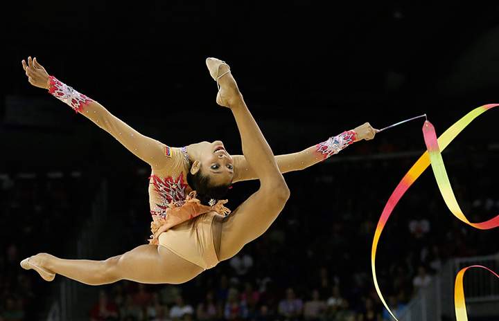 Venezuela’s Grisbel Lopez performs with the ribbon during individual all-around rhythmic gymnastics competition in the Pan Am Games in Toronto Saturday, July 18, 2015.