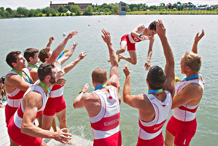 Canada’s men’s eight rowing team tosses Jacob Koudys into the water to celebrate their gold medal at the 2015 Pan Am Games on the Royal Canadian Henley Rowing Course in St. Catharines, Ont., Wednesday, July 15, 2015.