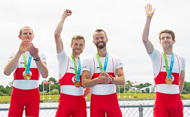 Members of Canada’s men’s lightweight coxless four, from left, Eric Woelfl, Nicolas Pratt, Brendan Hodge, and Maxwell Lattimer celebrate winning the gold medal at the 2015 Pan Am Games on the Royal Canadian Henley Rowing Course in St. Catharines, Ont., Wednesday, July 15, 2015.