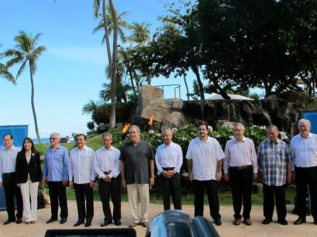 Trade ministers from 12 Pacific Rim nations negotiating the Trans-Pacific Partnership agreement pose for a group photo at a meeting in Lahaina, Hawaii on Thursday, July 30, 2015.