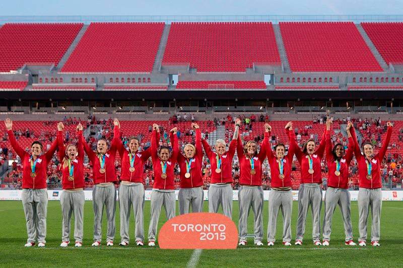 Canada’s womens rugby sevens team celebrate with their gold medals after beating USA 55-7 at the Pan Am Games in Toronto on Sunday, July 12, 2015.