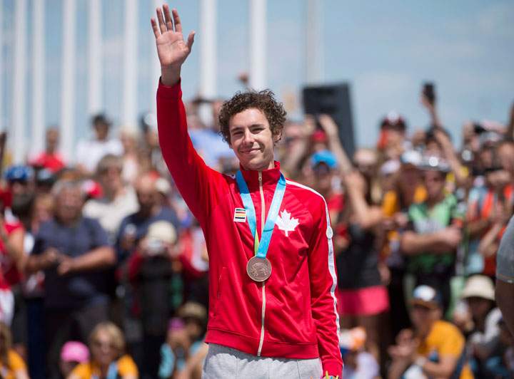 Sean MacKinnon of Canada poses with his bronze medal in men's individual time trial road cycling at the 2015 Pan Am Games in Milton, Ont. on Wednesday, July 22, 2015.