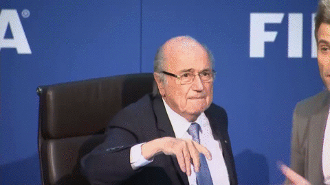 Blatter's news conference delayed by British comedian throwing dollar bills at FIFA president