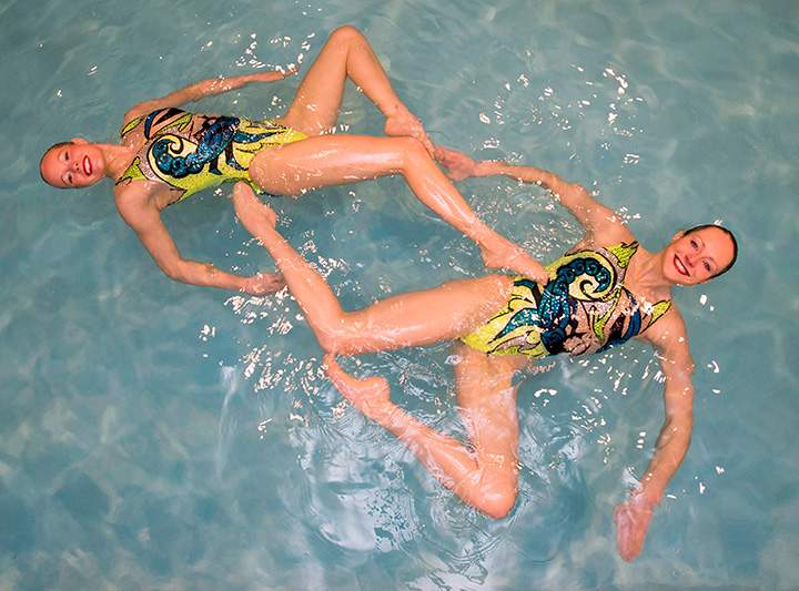 Canadian synchronized swimmers Jacqueline Simoneau (left) and Karine Thomas swim in a pool in Toronto on Tuesday January 27, 2015. 