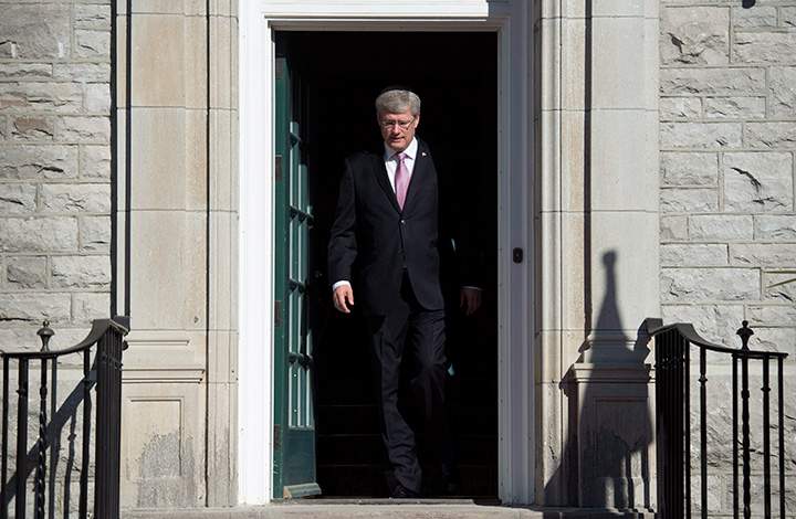 Prime Minister Stephen Harper steps out of his residence at 24 Sussex drive Monday June 9, 2014 in Ottawa.