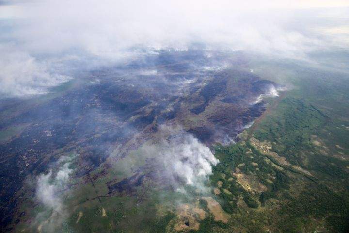 Out-of-control wildfire burns near North Tallcree First Nation Saturday, July 4, 2015.
