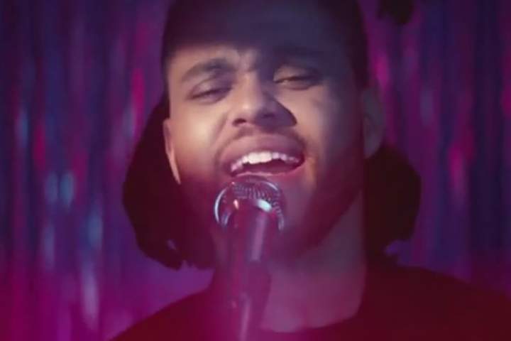 The Weeknd, pictured in a scene from the video for "Can't Feel My Face.".