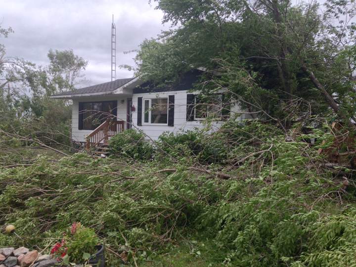 tornado house damage Manitoba storm trees down