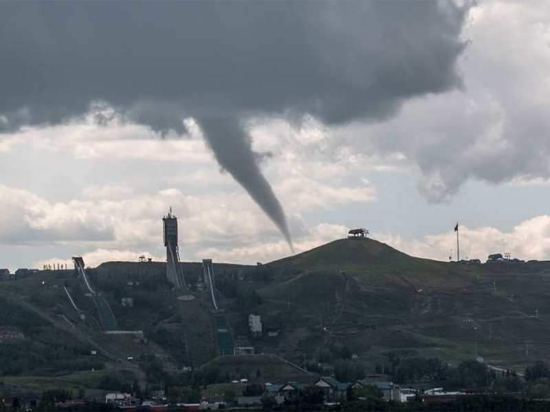 A funnel cloud is seen forming above Calgary on Wednesday, July 22, 2015.