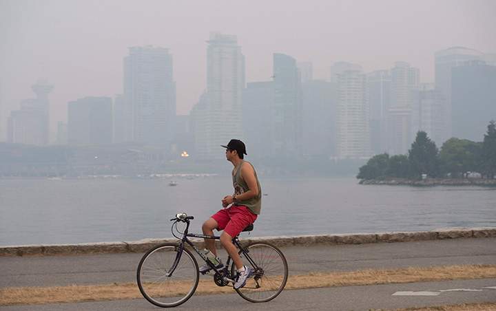 Smoke from wildfires in the interior of British Columbia blanket downtown Vancouver, B.C. Sunday, July 5 2015.