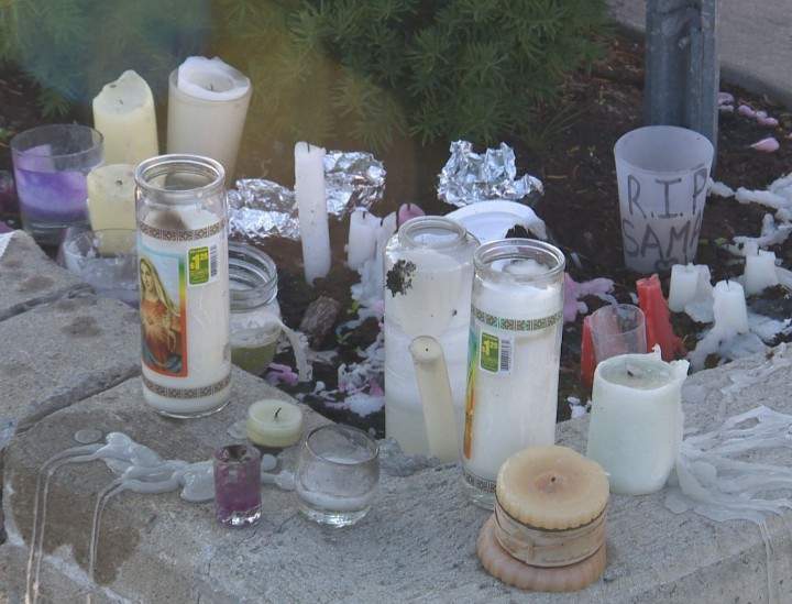Candles left behind after a vigil for Samantha Higgins, 22, who was found murdered on Friday, July 10, 2015.