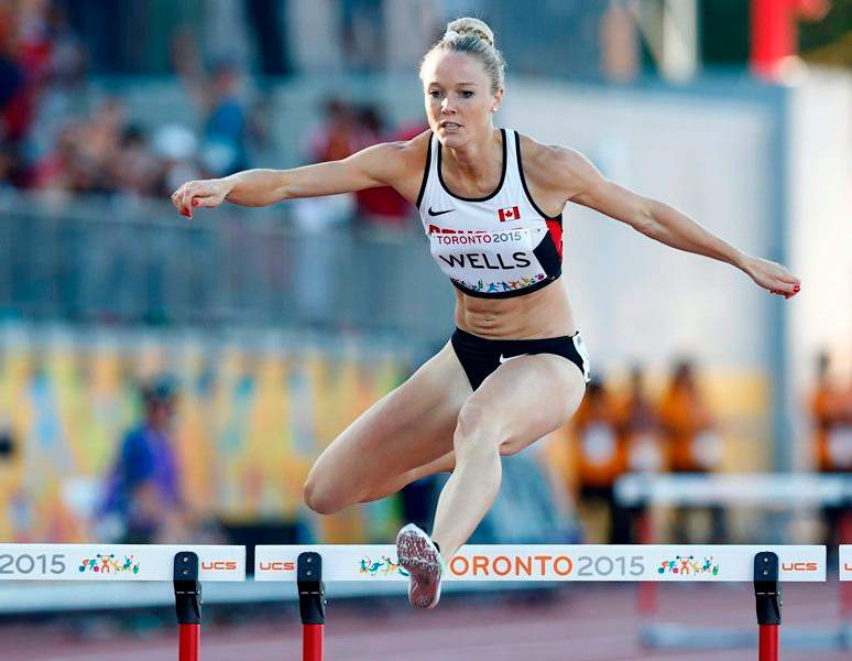 Sarah Wells, of Canada, races to winning a silver medal in the women’s 400m hurdles final during the athletics competition at the 2015 Pan Am Games in Toronto on Wednesday, July 22, 2015.