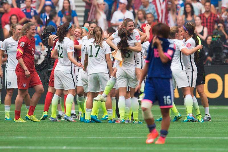 Japan’s Mana Iwabuchi looks on as the United States celebrates their victory in the FIFA Women’s World Cup soccer final in Vancouver, B.C., on Sunday, July 5, 2015.
