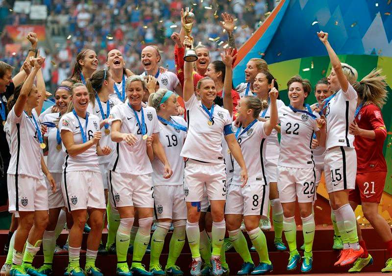 The United States Women’s National Team celebrates with the trophy after they beat Japan 5-2 in the FIFA Women’s World Cup soccer championship in Vancouver, British Columbia, Canada, Sunday, July 5, 2015.