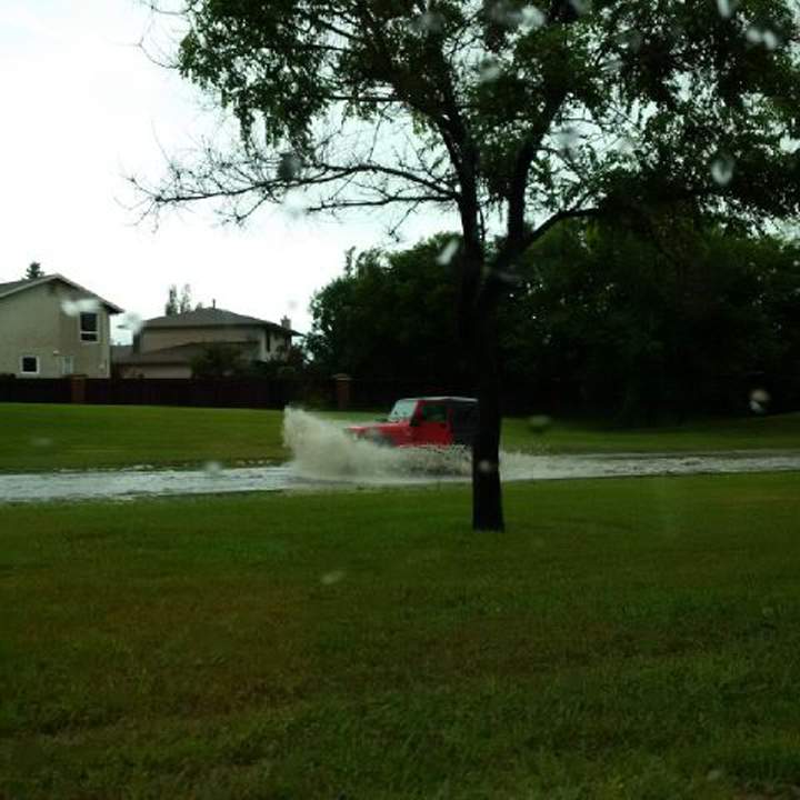 Winnipeg rain storm Manitoba flood Waverley Street