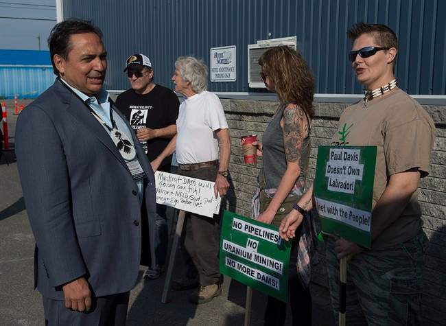 Perry Bellegarde, national chief of the Assembly of First Nations, talks with protesters at a meeting of Canadian premiers and national aboriginal leaders in Happy Valley-Goose Bay, Newfoundland and Labrador, on Wednesday.