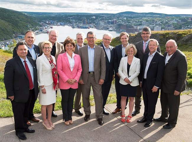 Nunavut Premier Peter Taptuna, Yukon Premier Darrell Pasloski, Ontario Premier Kathleen Wynne, Prince Edward Island Premier Wade MacLauchlan, British Columbia Premier Christy Clark, Quebec Premier Philippe Couillard, Newfoundland and Labrador Premier Paul Davis, Manitoba Premier Greg Selinger, New Brunswick Premier Brian Gallant, Alberta Premier Rachel Notley, Nova Scotia Premier Stephen McNeil, Saskatchewan Premier Brad Wall and Northwest Territories Premier Bob McLeod, left to right, pose for a group photo on Signal Hill overlooking the harbour at the summer meeting of Canada's premiers in St. John's on Thursday, July 16, 2015.