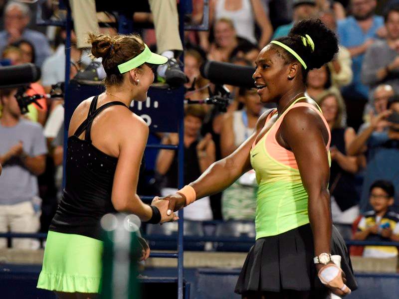 Belinda Bencic, right, of Switzerland, is congratulated by Serena Williams after she defeated Williams, of the United States, during Rogers Cup semi-final tennis action in Toronto on Saturday, August 15, 2015.
