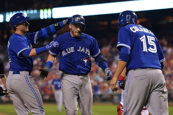 Josh Donaldson #20 of the Toronto Blue Jays is congratulated by teammates Troy Tulowitzki #2 and Chris Colabello #15 after a three run home run in the sixth inning against the Philadelphia Phillies at Citizens Bank Park on August 18, 2015 in Philadelphia, Pennsylvania. The Blue Jays won 8-5.  (Photo by Drew Hallowell/Getty Images).